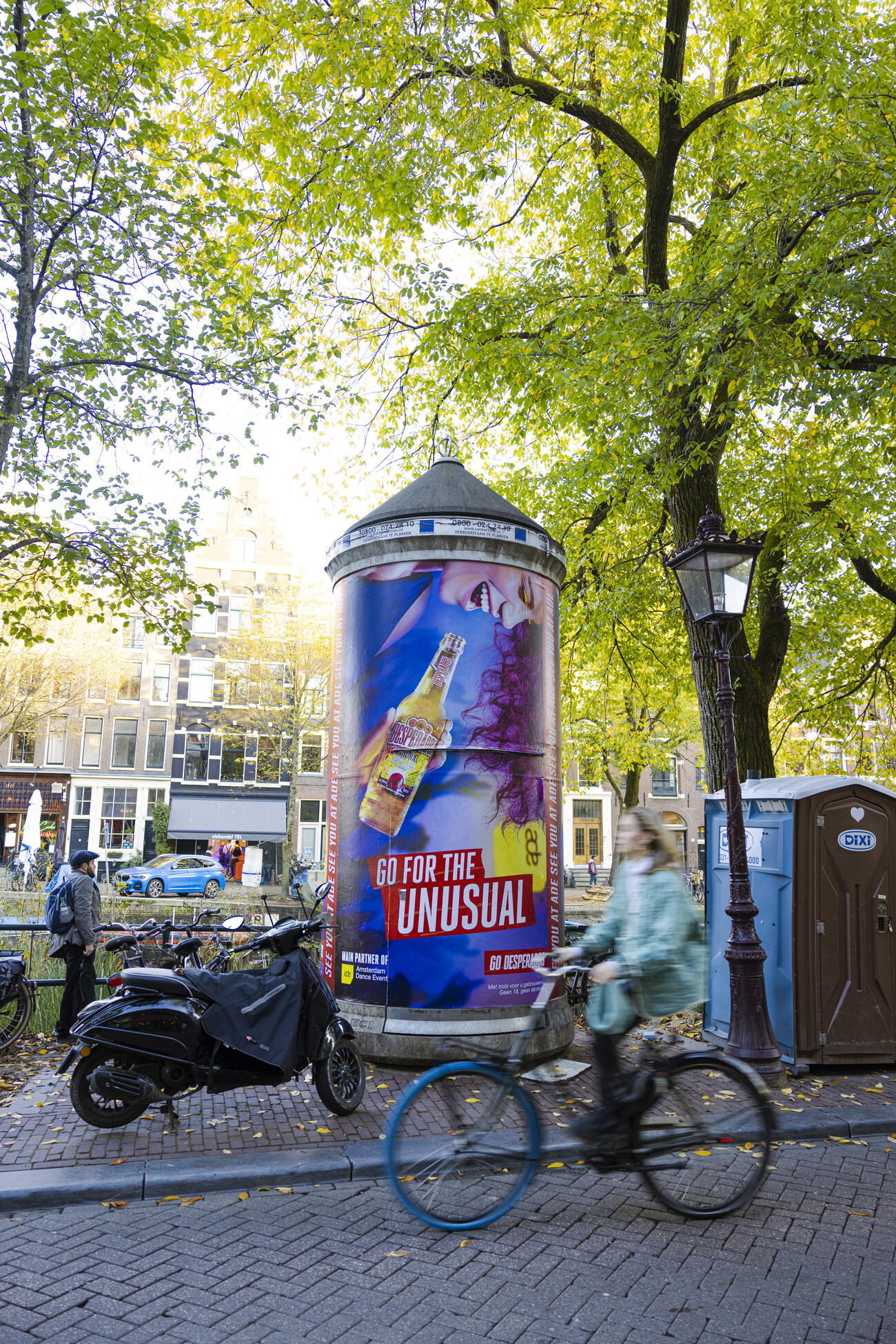 Advertising column beside an Amsterdam canal