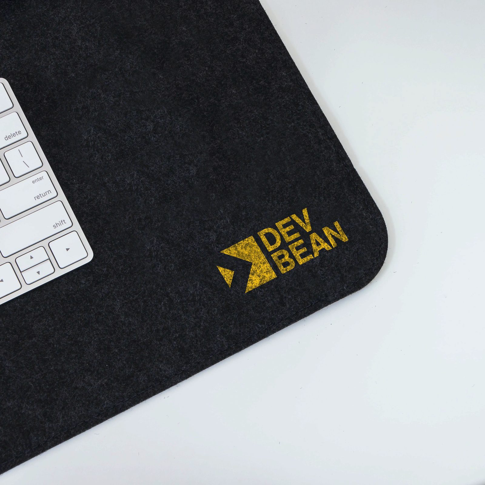 DevBean logo applied on a desk mat