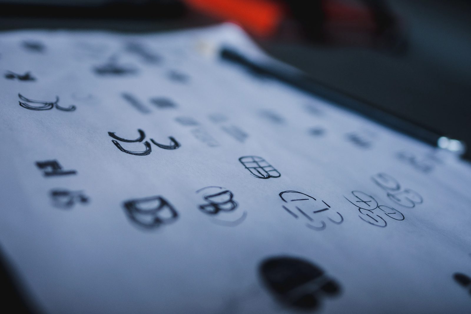 Logo sketches on paper for the DevBean mark